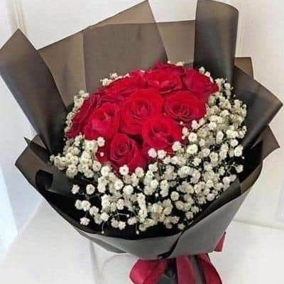 12 stems of Red roses with gypsophila beautiful crafted for that special person