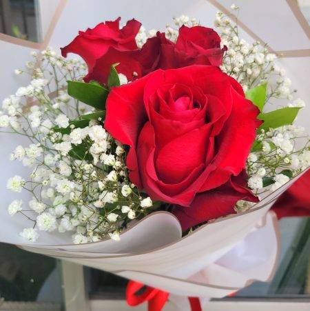 3 stems of Red roses mix with gypsophila