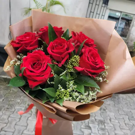 6 stems of Red roses mix with limonium and skimmia