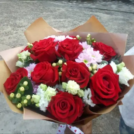 A Mix of 10 Red roses and other flowers with fillers